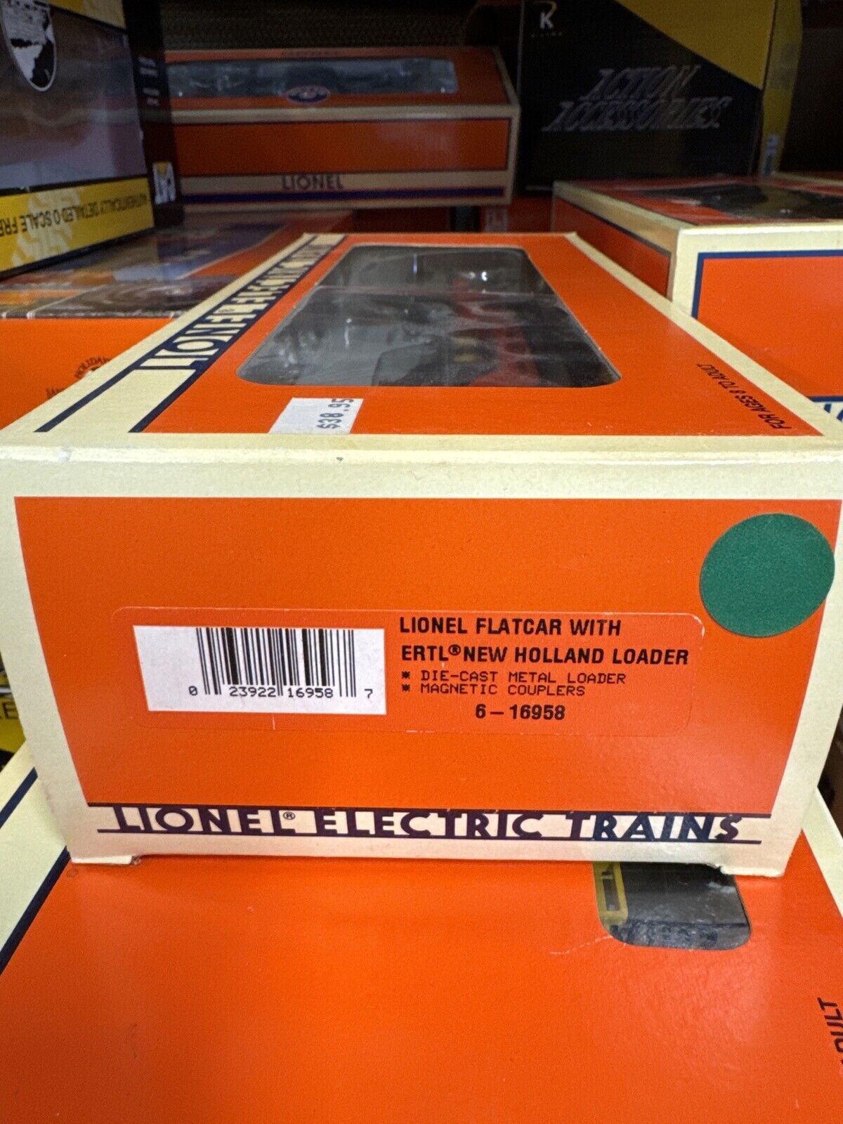 LIONEL FLAT CAR  16958 , LIONEL W/ERTL NEW HOLLAND LOADER 0-027 GA. - WISE GUYS HOBBIES LLC