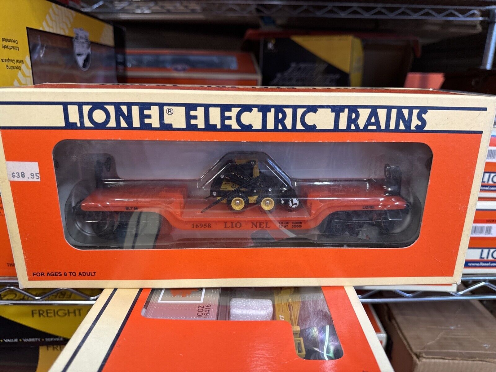 LIONEL FLAT CAR  16958 , LIONEL W/ERTL NEW HOLLAND LOADER 0-027 GA. - WISE GUYS HOBBIES LLC