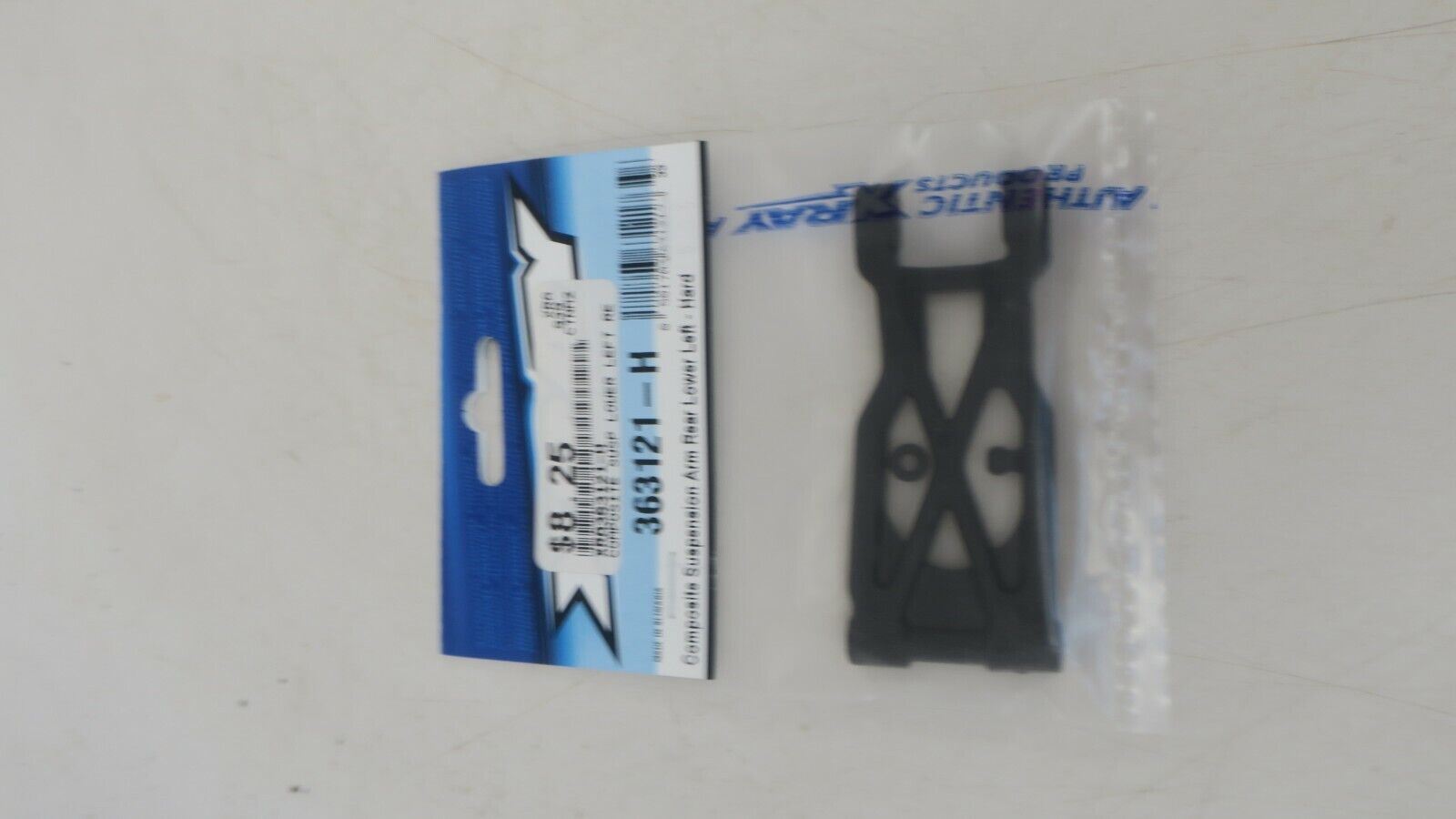 XRAY 363121 COMPOSITE SUSPENSION ARM REAR LOWER LEFT - WISE GUYS HOBBIES LLC