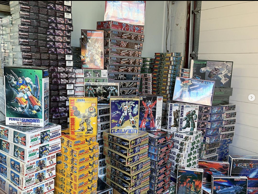 Stacks of Gundam, and Macross Model Kits.